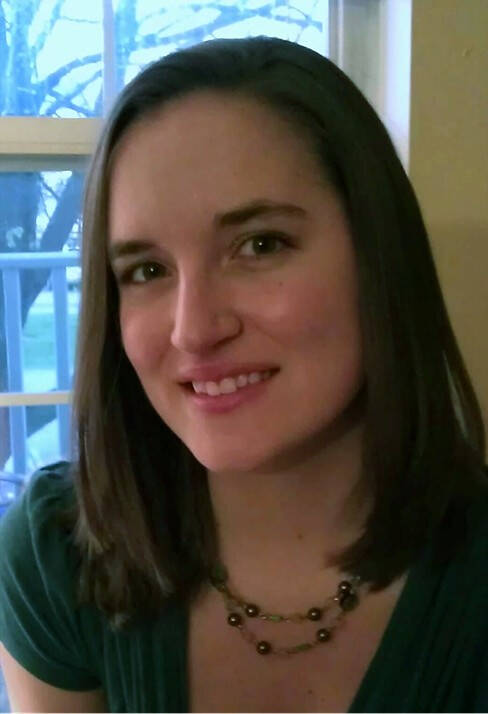Becky Sikkema wearing a green shirt and necklace